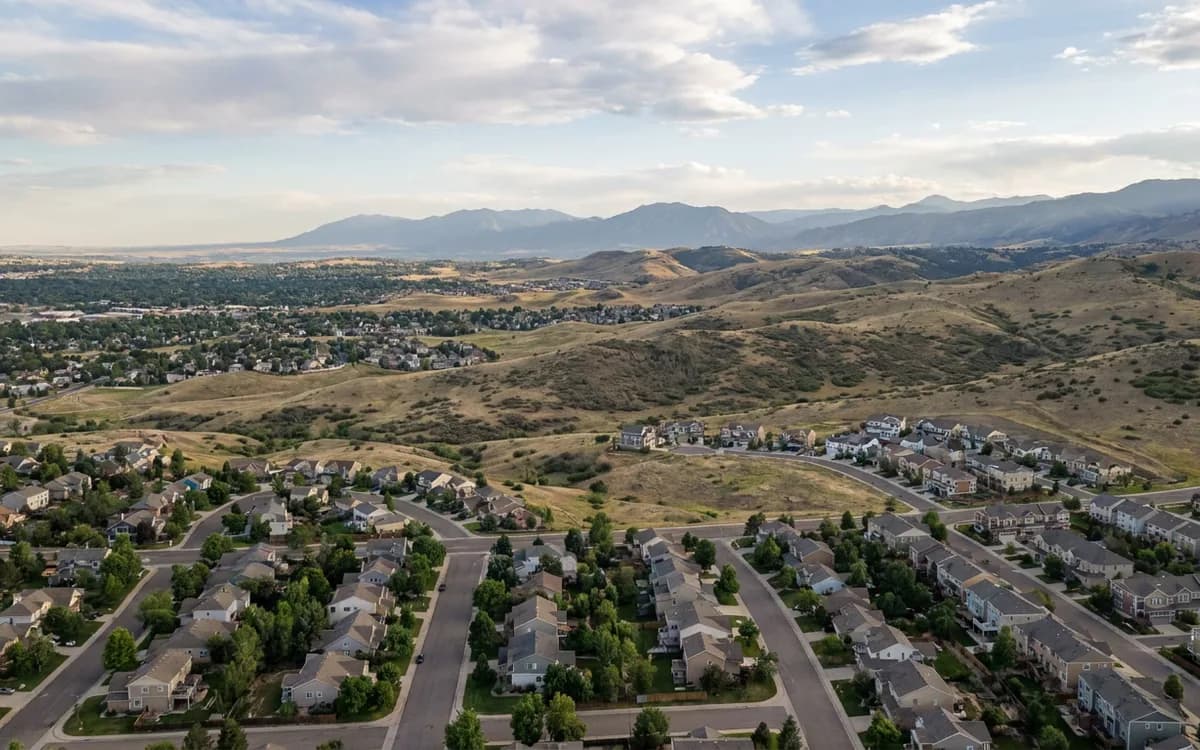 Colorado Front Range suburban neighborhoods beneath distant foothills
