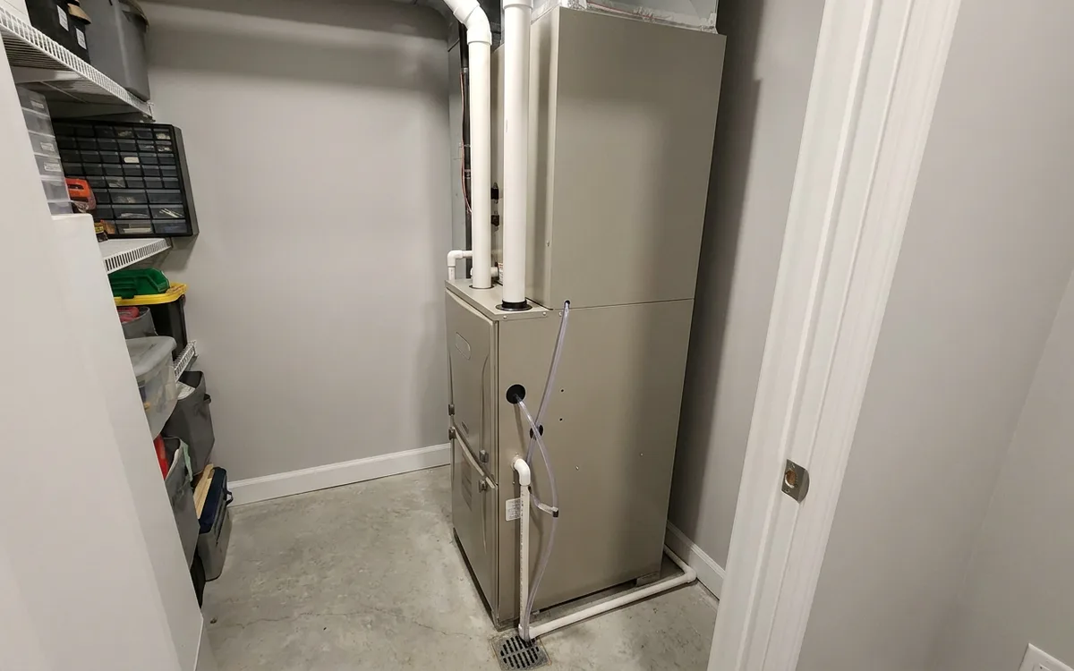 Recent-model gas furnace with PVC venting in a clean mechanical closet