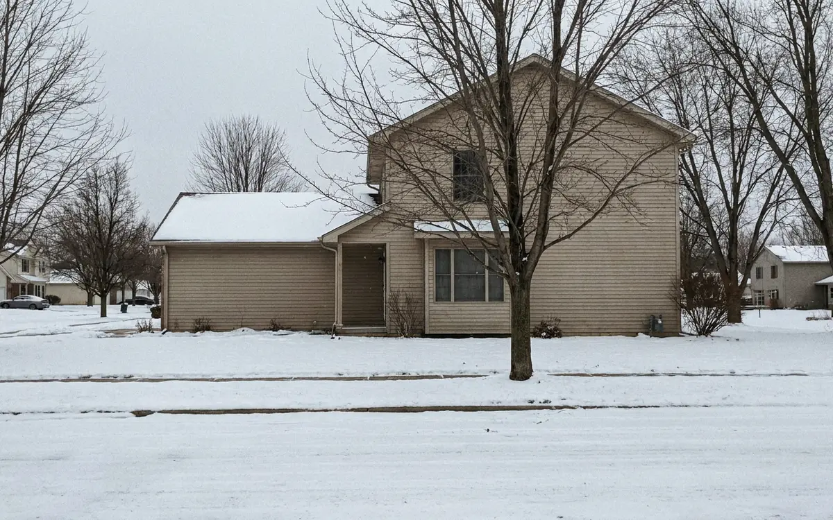 Suburban homes with attached garages on a Westminster street